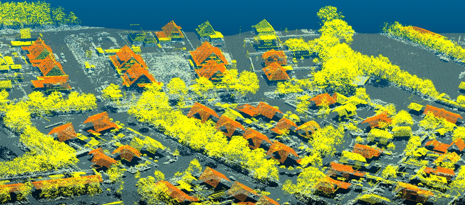 LiDAR puntenwolk van een woonwijk — gebouwen en vegetatie geclassificeerd in kleur voor terreinanalyse en GIS-verwerking